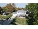 Two-story house on a tree-lined street, with a driveway and yard at 6031 S Eaton Ave, Indianapolis, IN 46259