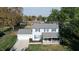 Two-story home with attached garage and front porch at 6031 S Eaton Ave, Indianapolis, IN 46259