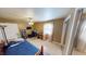 Bright bedroom featuring a bed, desk, and mirrored closet at 6031 S Eaton Ave, Indianapolis, IN 46259