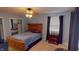 Serene bedroom with a queen bed and plenty of closet space at 6031 S Eaton Ave, Indianapolis, IN 46259