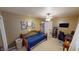 Cozy bedroom with a daybed, workspace, and ample closet space at 6031 S Eaton Ave, Indianapolis, IN 46259