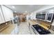 Galley style kitchen with stainless steel appliances and ample storage at 6031 S Eaton Ave, Indianapolis, IN 46259