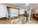 Well-equipped kitchen featuring granite countertops and a double sink at 6031 S Eaton Ave, Indianapolis, IN 46259