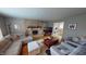 Living room with fireplace, sectional sofa, and hardwood floors at 6031 S Eaton Ave, Indianapolis, IN 46259