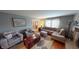 Living room with sectional sofa, hardwood floors and fireplace at 6031 S Eaton Ave, Indianapolis, IN 46259