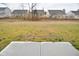 Grass backyard with a concrete patio, providing a nice outdoor area at 6329 Basden Dr, Indianapolis, IN 46221