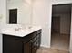 Bathroom with a double vanity and view of bedroom at 6329 Basden Dr, Indianapolis, IN 46221