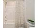 Clean bathroom with a shower/tub and patterned shower curtain at 6329 Basden Dr, Indianapolis, IN 46221