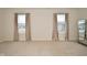Well-lit bedroom with two large windows and neutral carpeting at 6329 Basden Dr, Indianapolis, IN 46221