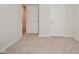 Bedroom with neutral walls, carpet, and two closets at 6329 Basden Dr, Indianapolis, IN 46221