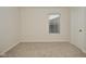 Spacious bedroom featuring neutral walls and carpet at 6329 Basden Dr, Indianapolis, IN 46221