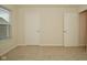 Well-lit bedroom with neutral walls and carpet flooring at 6329 Basden Dr, Indianapolis, IN 46221