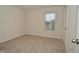 Bright bedroom with neutral walls and carpet at 6329 Basden Dr, Indianapolis, IN 46221