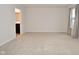 Spacious bedroom with access to bathroom and window at 6329 Basden Dr, Indianapolis, IN 46221