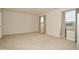 Simple bedroom with neutral walls and carpet, and two windows at 6329 Basden Dr, Indianapolis, IN 46221