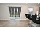 Kitchen features a breakfast bar and sliding glass doors to patio at 6329 Basden Dr, Indianapolis, IN 46221