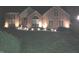 House exterior at night with landscape lighting at 8429 Admirals Cv, Indianapolis, IN 46236