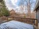 Spacious back deck with wooden railings, overlooking a wooded area at 8530 Bluefin Cir, Indianapolis, IN 46236