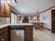 Kitchen with views into adjacent dining area and fireplace at 8530 Bluefin Cir, Indianapolis, IN 46236