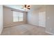 Charming bedroom with carpeted floors and large window at 8623 Faulkner Dr, Indianapolis, IN 46239