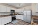 Modern kitchen with stainless steel appliances and white cabinets at 9549 W Quarter Moon Dr, Pendleton, IN 46064