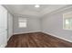 Well lit bedroom with hardwood floors and neutral colored walls at 111 Independence Ave, Anderson, IN 46012