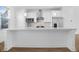 Modern kitchen with white cabinets, stainless steel appliances, and an island at 1718 E 10Th St, Indianapolis, IN 46201