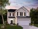 Two-story house with beige siding, dark gray shutters, and a white garage door, at dusk at 1837 James Pierce Dr, Shelbyville, IN 46176