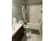 Bathroom with tub, shower, toilet, and dark vanity at 2162 Sumpter Trl, Columbus, IN 47203