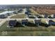 Aerial view of a new home community with a pond at 2400 Oakmont Dr, Plainfield, IN 46168