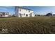 Large backyard with grassy lawn and a two story home at 2400 Oakmont Dr, Plainfield, IN 46168