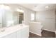 Bathroom with double vanity, shower, and dark floors at 2400 Oakmont Dr, Plainfield, IN 46168