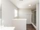 Modern bathroom with a large walk-in shower and dark wood-look flooring at 2400 Oakmont Dr, Plainfield, IN 46168