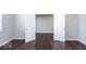 Bright bedroom with hardwood floors and an open door to another room at 2400 Oakmont Dr, Plainfield, IN 46168