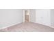 Spacious bedroom with neutral walls and carpet at 2400 Oakmont Dr, Plainfield, IN 46168
