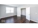 Bedroom with hardwood floors, neutral walls, and a window with blinds at 2400 Oakmont Dr, Plainfield, IN 46168
