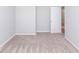 Well-lit bedroom with neutral walls and carpet at 2400 Oakmont Dr, Plainfield, IN 46168