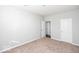 Well-lit bedroom with neutral walls and carpet at 2400 Oakmont Dr, Plainfield, IN 46168