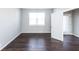 Bright bedroom with hardwood floors and a window offering natural light at 2400 Oakmont Dr, Plainfield, IN 46168