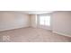 Spacious bonus room with neutral wall paint and carpet at 2400 Oakmont Dr, Plainfield, IN 46168