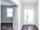 Bright entryway with hardwood floors and an open door to another room at 2400 Oakmont Dr, Plainfield, IN 46168