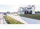 Two-story house with white siding, brick accents, and a three-car garage at 2400 Oakmont Dr, Plainfield, IN 46168