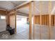 Unfinished two-car garage with concrete floor at 2400 Oakmont Dr, Plainfield, IN 46168