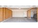 Unfinished two-car garage with concrete floor at 2400 Oakmont Dr, Plainfield, IN 46168