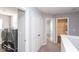 Hallway with laundry, closets and bathroom access at 2400 Oakmont Dr, Plainfield, IN 46168