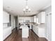Modern kitchen with stainless steel appliances and white cabinets at 2400 Oakmont Dr, Plainfield, IN 46168