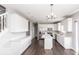 Modern kitchen with white cabinets and island at 2400 Oakmont Dr, Plainfield, IN 46168