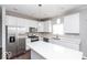 Spacious kitchen featuring stainless steel appliances and white cabinetry at 2400 Oakmont Dr, Plainfield, IN 46168