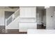 Kitchen features white cabinets, quartz countertops and a built-in bench at 2400 Oakmont Dr, Plainfield, IN 46168