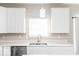 Kitchen features white cabinets, quartz countertops and a double sink at 2400 Oakmont Dr, Plainfield, IN 46168